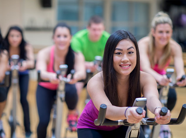 group of people in a spinning class