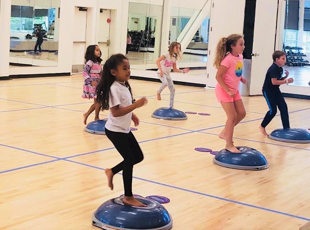 children working out in a fitness center near me