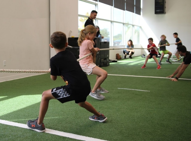 kids play tug-of-war in a safe and secure environment at the fitness equation gym in virginia